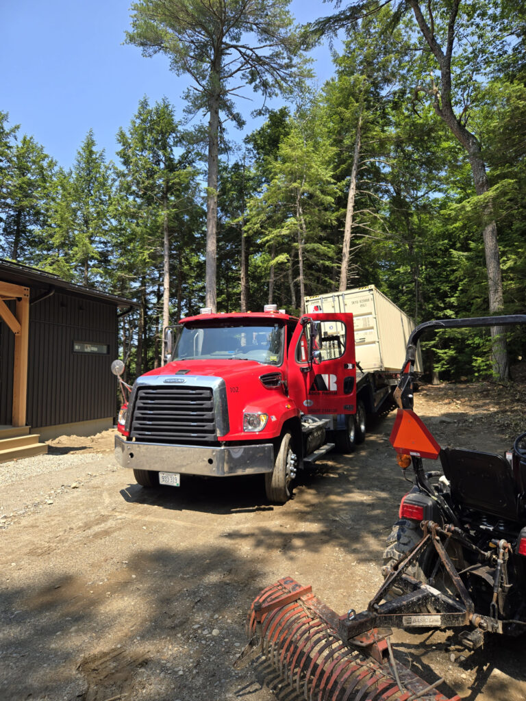 40-foot storage container rental used to secure equipment and supplies for a new home build in Gardiner, ME 04345