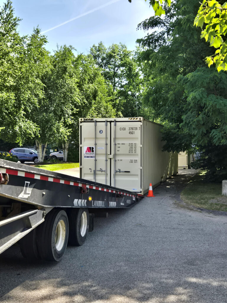 Ground-level 40ft shipping container parked near the Residence Inn during a hospitality remodel