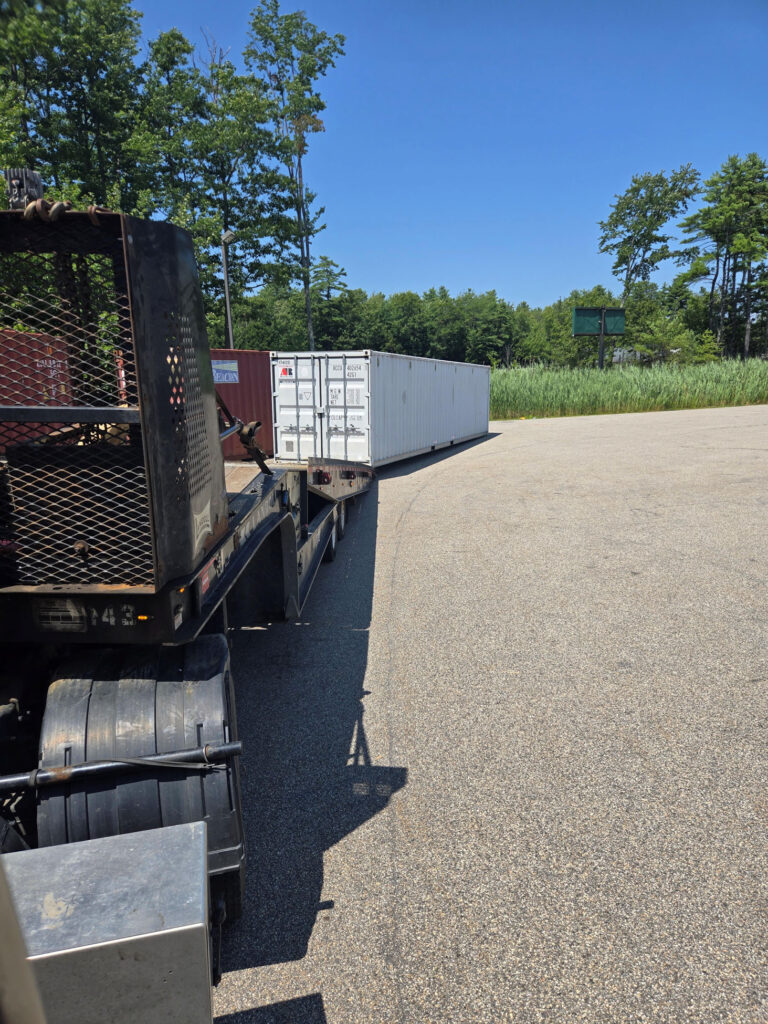 Four 40-foot storage containers being picked up for fireworks company yearly overstock storage