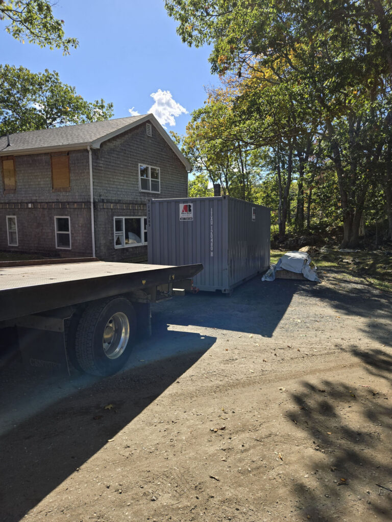 20ft storage container rental delivered to Biddeford Pool ME 04005 driveway for home renovation by Abco Rental & Storage, Inc
