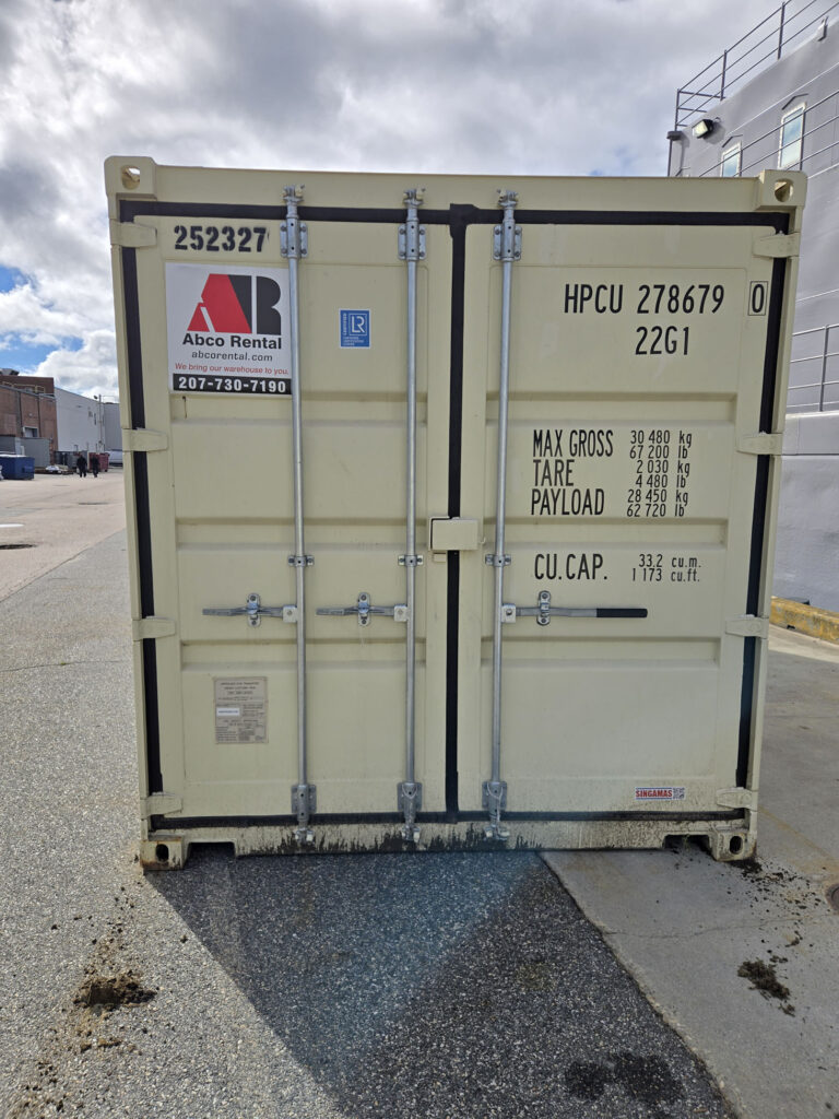 Two Abco Rental and Storage 20ft shipping containers staged for transport between Portsmouth Naval Shipyard and Groton Connecticut