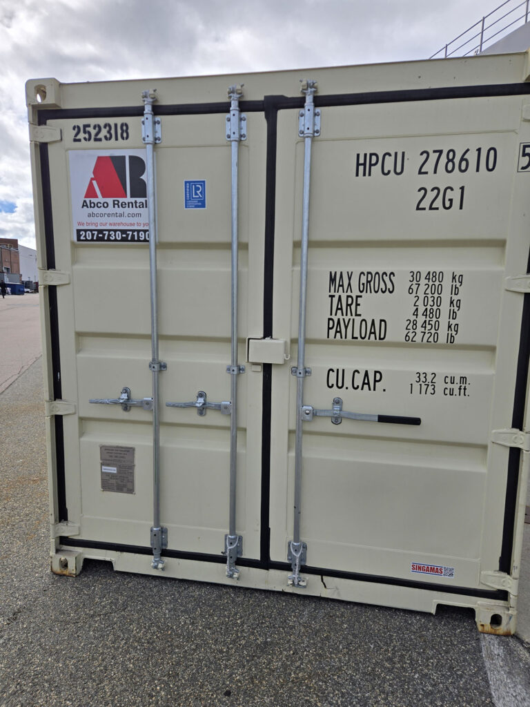 Two Abco Rental and Storage 20ft shipping containers staged for transport between Portsmouth Naval Shipyard and Groton Connecticut