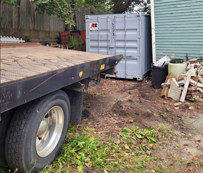20 ft storage container rental delivered Biddeford, Mane to help clean out a garage.